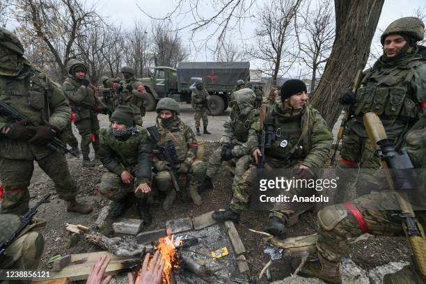 Pro-Russian separatists, in uniforms without insignia, gather in the separatist-controlled settlement of Mykolaivka and Bugas, in Donetsk region of...