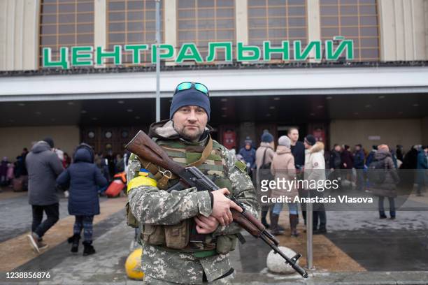 Ukrainian serviceman stands guard outside the central railway station on March 1, 2022 in Kyiv, Ukraine. Russian forces continued to advance on the...
