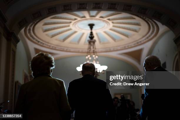 Flanked by Sen. Debbie Stabenow and Sen. Tom Carper , Senate Majority Leader Chuck Schumer speaks during a news conference following a lunch meeting...