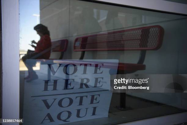 Voter sits on a bench outside of a polling location during primary elections in Corpus Christi, Texas, U.S., on Tuesday, March 1, 2022. Texas will be...
