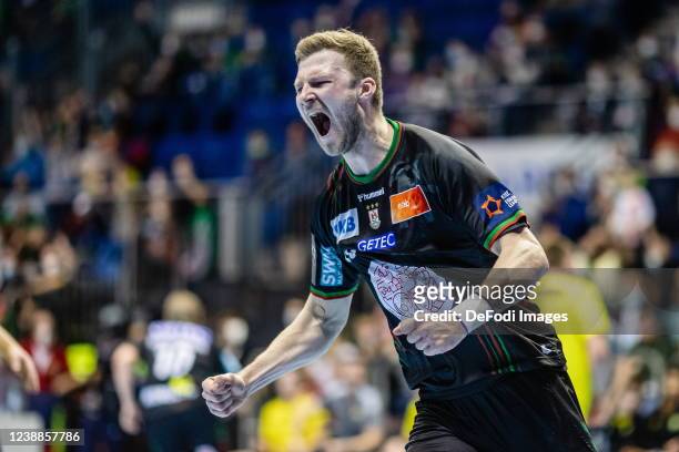 Philipp Weber of Germany of SC Magdeburg celebrates after scoring during the EHF European League match between SC Magdeburg and IK Sävehof at...