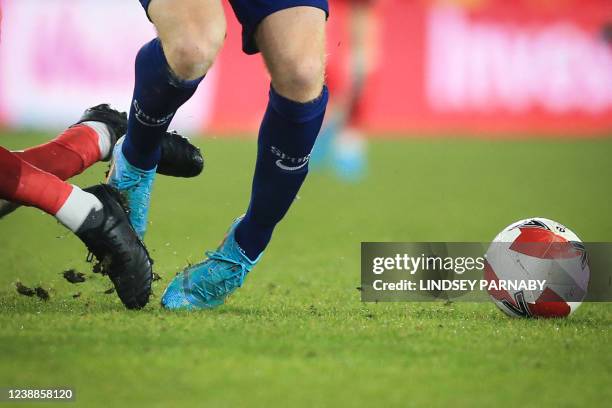 Middlesbrough's English midfielder Jonny Howson fights for the ball with Tottenham Hotspur's Swedish midfielder Dejan Kulusevski during the English...