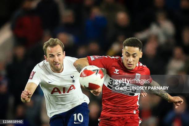 Tottenham Hotspur's English striker Harry Kane fights for the ball with Middlesbrough's English midfielder Marcus Tavernier during the English FA cup...