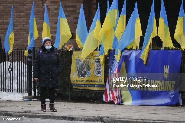 Person waits for a bus on West Chicago Avenue in Chicago&apos;s Ukrainian Village neighborhood on Tuesday.