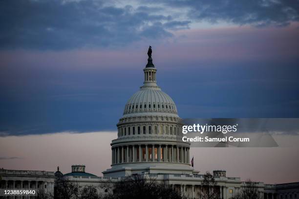 The U.S. Capitol building is seen at sunset ahead of President Joe Biden's first State of the Union address to Congress on March 1, 2022 in...