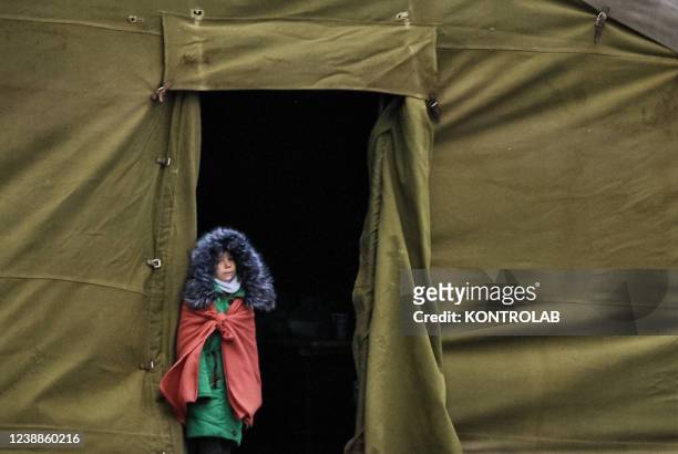 Ukrainian refugee girl at the Albita border crossing, on the border between Moldavia and eastern Romania, in a tent set up for refugees fleeing the...