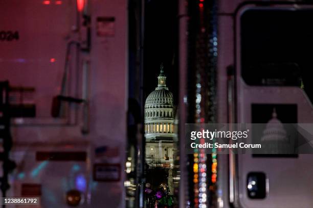 The U.S. Capitol building is seen through an Architect of the Capitol vehicle that is being used to block off a street ahead of U.S. President Joe...
