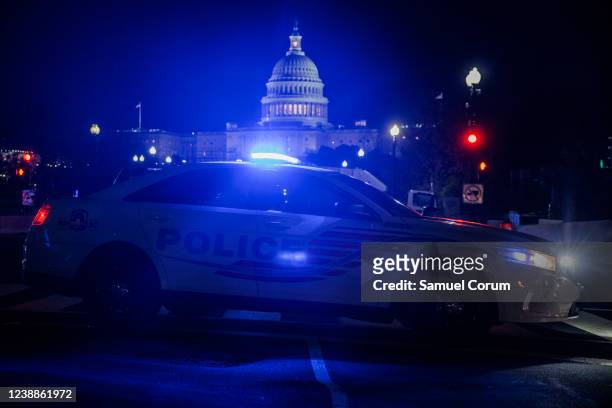 Police car blocks off a street near the U.S. Capitol building ahead of U.S. President Joe Biden's first State of the Union address to a joint session...