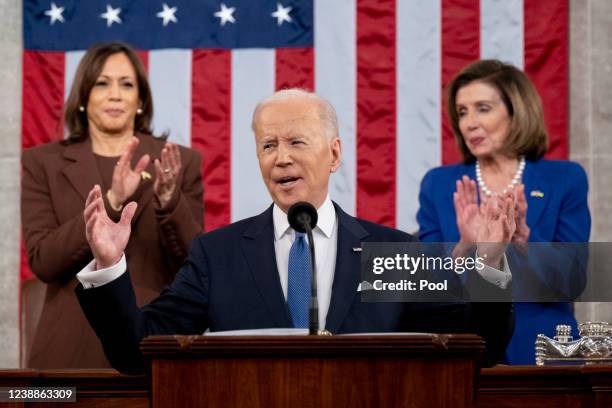 President Joe Biden arrives to deliver the State of the Union address as U.S. Vice President Kamala Harris and House Speaker Nancy Pelosi look on...