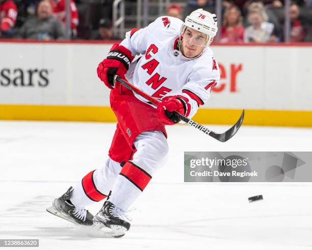 Brady Skjei of the Carolina Hurricanes shoots the puck into the zone during the second period of an NHL game against the Detroit Red Wings at Little...