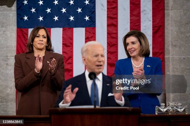 President Joe Biden arrives to deliver the State of the Union address as U.S. Vice President Kamala Harris and House Speaker Nancy Pelosi look on...