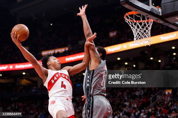Scottie Barnes of the Toronto Raptors puts up a shot over LaMarcus Aldridge of the Brooklyn Nets during the second half of their NBA game at...