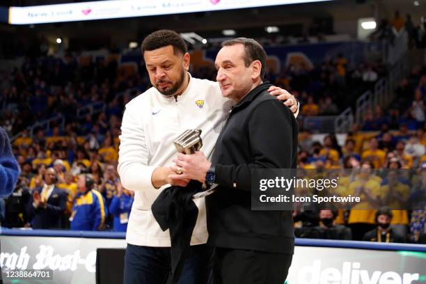 Pittsburgh, PA Pittsburgh Panthers coach Jeff Capel hugs Duke Blue Devils coach Mike Krzyzewski after presenting Coach K with a fist made from...