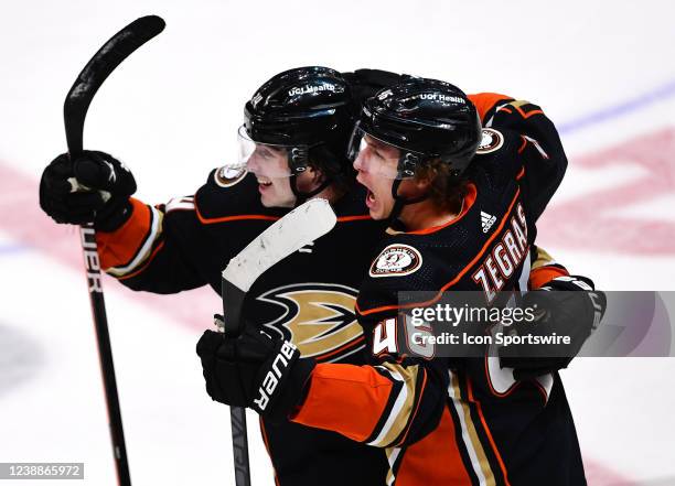 Anaheim Ducks defenseman Jamie Drysdale and center Trevor Zegras reacts after Zegras scored the go ahead and eventual game winning goal late in the...