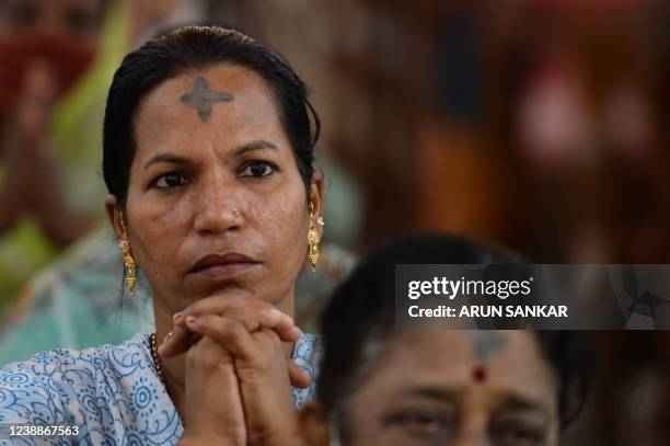 Catholic Christian devotees attend a holy mass during an Ash Wednesday service at St. Thomas Cathedral Basilica in Chennai on March 2, 2022.