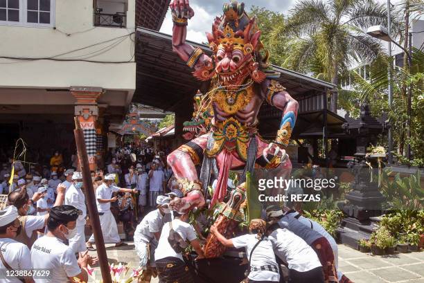Hindu devotees parade an "ogoh-ogoh" giant statue as part of the Tawur Agung Kesanga prayer ritual in Bekasi on March 2 2022, ahead of "Nyepi", the...