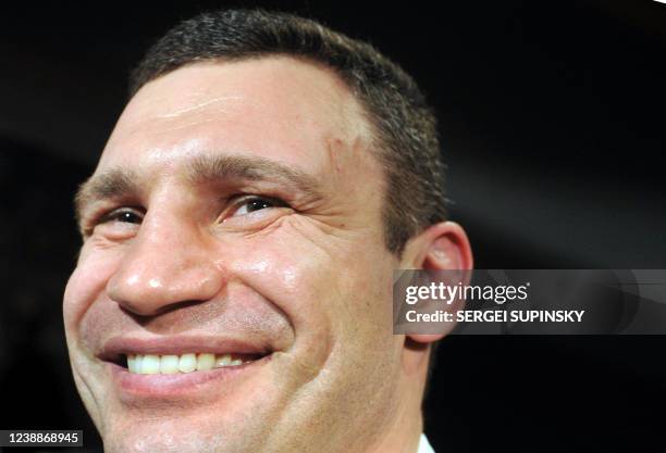 Ukrainian WBC heavyweight champion Vitali Klitschko smiles during a press conference in Kiev on March 23, 2010. Klitschko, who retained his title by...