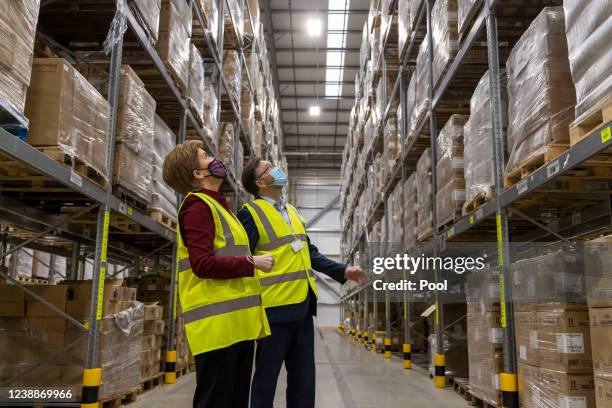 First Minister Nicola Sturgeon is given a tour by Gordon Beattie, Director of National Procurement for NHS National Services Scotland, during a visit...