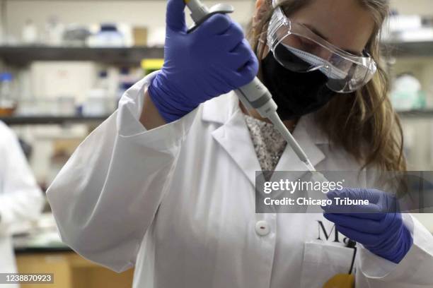 University of Chicago graduate student Maria Hernandez LimOn extracts DNA from water filters used in Lake Ontario and Lake Superior in 2013, on Feb....