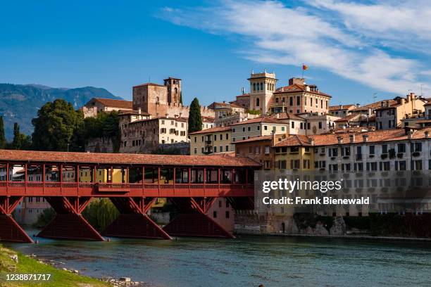 The bridge Ponte Vecchio, Ponte degli Alpini, leading over the river Brenta in Bassano del Grappa, facades of medieval houses facing the water.