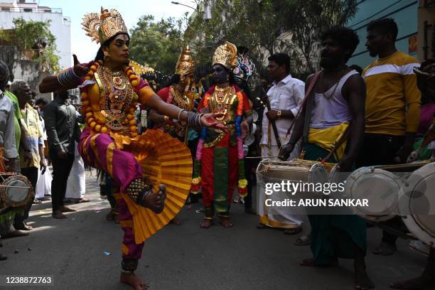 Hindu devotee dressed as Hindu goddesses Durgha dances during a procession on the occasion of 'Maha Shivratri' festival in Chennai on March 2, 2022.