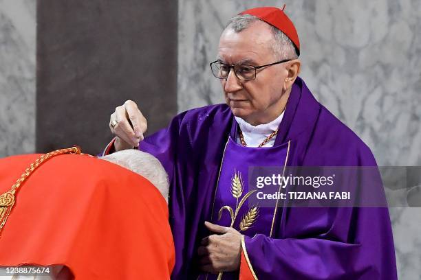 Cardinal receives ashes on the head from Cardinal and Vatican Secretary of State Pietro Parolin during the Ash Wednesday mass which opens Lent, the...