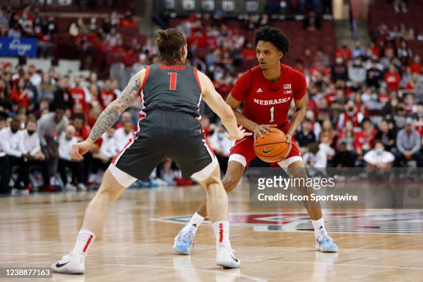 Nebraska Huskers guard Alonzo Verge Jr. With the ball guarded by Ohio State Buckeyes guard Jimmy Sotos in a game between the Nebraska Huskers and the...