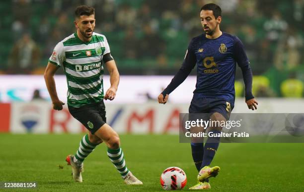 Bruno Costa of FC Porto with Paulinho of Sporting CP in action during the Portuguese Cup Semifinal match between Sporting CP and FC Porto at Estadio...
