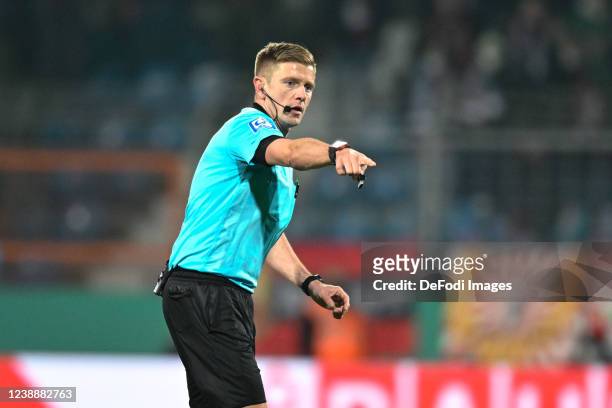Referee Robert Schroeder gestures during the DFB Cup quarter final match between VfL Bochum and SC Freiburg at Vonovia Ruhrstadion on March 2, 2022...