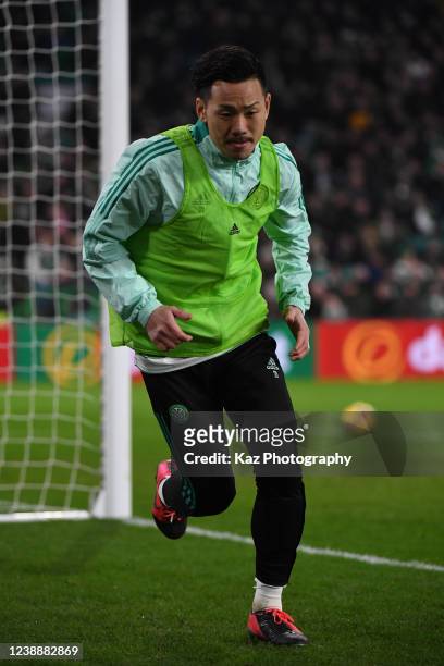 Yosuke Ideguchi of Celtic warms up during the Ladbrokes Scottish Premiership match between Celtic and St Mirren at Celtic Park on March 2, 2022 in...