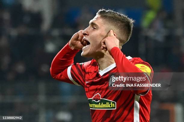 Freiburg's Hungarian midfielder Roland Sallai celebrates scoring at the end of extra time during the German Cup quarter-final football match VfL...