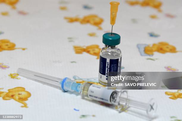 Health worker prepares a measles vaccine in a hospital of Montenegro's capital Podgorica on February 16, 2020. - The dramatic decline in inoculation...