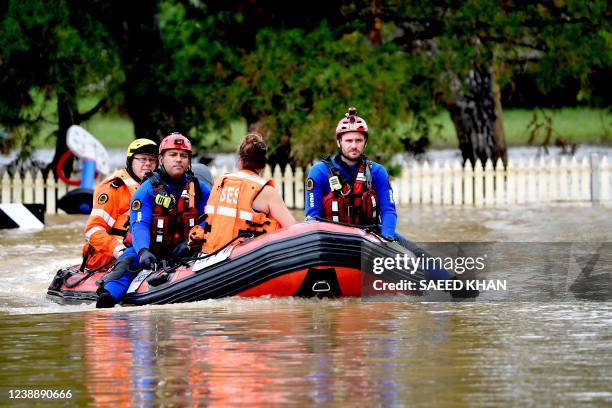 Volunteers of State Emergency Services rescue residents after floodwater inundated their houses in western Sydney on March 3, 2022.