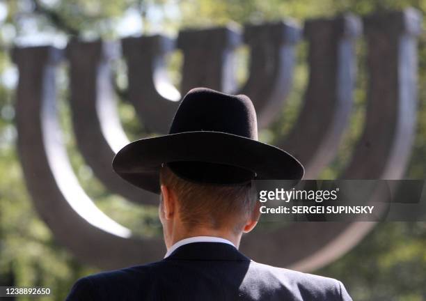 Ukrainian member of the Jewish community attends a memorial ceremony at the Minora monument in Babi Yar, in Kiev, 23 September 2007. Babi Yar, a...