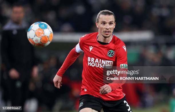 Hanover's Swedish midfielder Niklas Hult plays the ball during the German Cup quarter-final football match Hanover v RB Leipzig in Hanover, western...