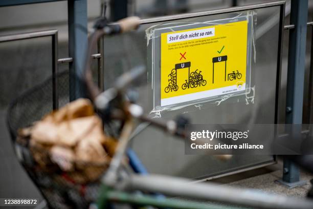 March 2022, Berlin: A sign at the Wedding S-Bahn and U-Bahn station indicates that bicycles are not allowed to be parked on the railing. Several...