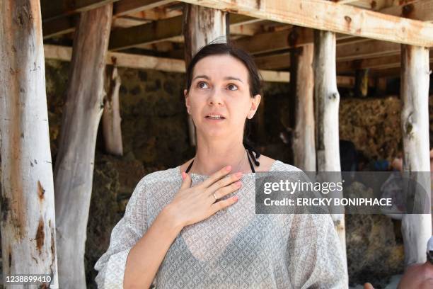 Ukrainian tourist Petrova Oksana speaks during an interview with AFP at the beach of a hotel in Zanzibar on March 3, 2022 after having been left...