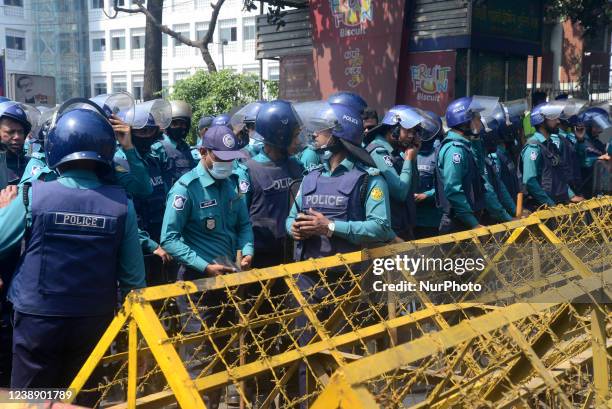 Riot police block the street during the demonstration of activists of leftist party Ganosonghoti Andolon against hike in prices of daily necessities...