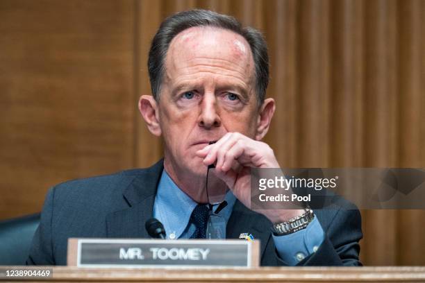 Ranking member Sen. Pat Toomey listens as U.S. Federal Reserve Chair Jerome Powell testifies at a Senate Banking, Housing, and Urban Affairs...