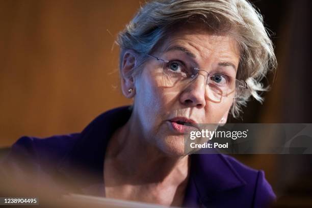 Sen. Elizabeth Warren questions U.S. Federal Reserve Chair Jerome Powell as he testifies at a Senate Banking, Housing, and Urban Affairs Committee...