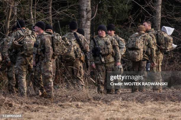 Soldiers are seen near a military camp in Arlamow, southeastern Poland, near the border with Ukraine, on March 3, 2022.