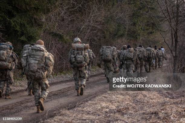 Soldiers are seen near a military camp in Arlamow, southeastern Poland, near the border with Ukraine, on March 3, 2022.