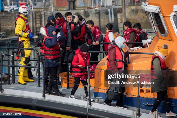 Asylum seekers arriving into Dover docks on board the Dover RNLI boat after being rescued in the English Channel while crossing on the 3rd of March...