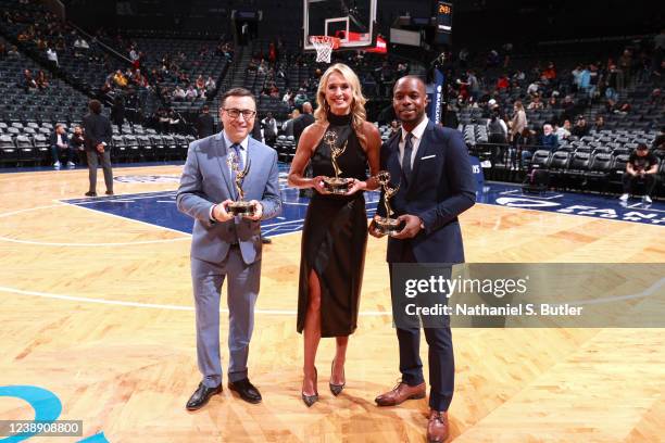 Networks, Ian Eagle, Sarah Kustok and Michael Grady pose for a photo with their Emmy Award before the game between the Miami Heat and the Brooklyn...