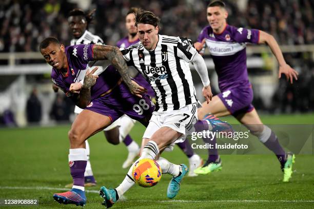 Igor Julio of ACF Fiorentina and Dusan Vlahovic of Juventus FC compete for the ball during the Italy cup semifinal football match between ACF...