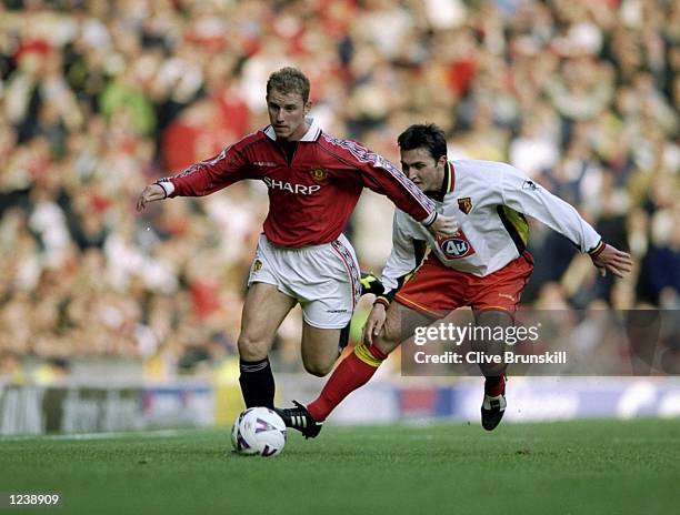 Nicky Butt of Manchester United beats Richard Johnson of Watford during the FA Carling Premiership match at Old Trafford in Manchester, England....