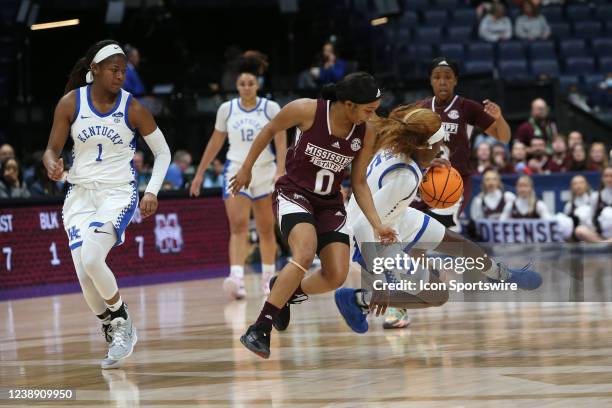 Mississippi State Bulldogs guard Anastasia Hayes and Kentucky Wildcats guard Blair Green collide going for a loose ball at mid-court during a second...