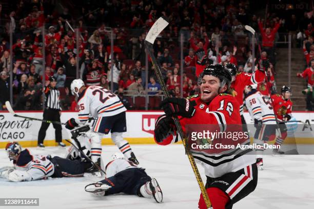 Alex DeBrincat of the Chicago Blackhawks reacts after scoring the game winning goal in overtime against the Edmonton Oilers at United Center on March...