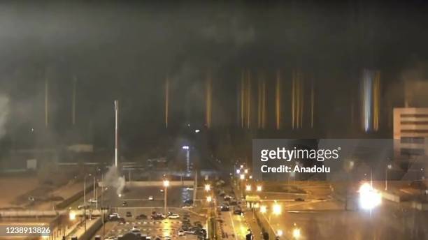 Screen grab captured from a video shows a view of Zaporizhzhia nuclear power plant during a fire following clashes around the site in Zaporizhzhia,...