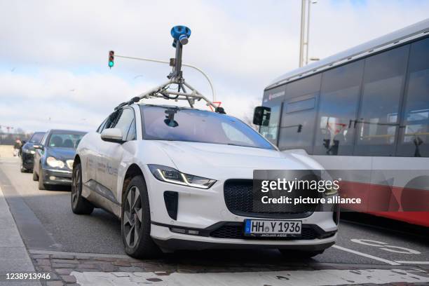 March 2022, Hamburg: A vehicle from the Internet company Google in the city center. The electric car with sensor technology is to measure air...